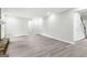 Spacious room featuring wood-look floors, neutral walls and white trim at 2487 Highland Se Dr, Conyers, GA 30013