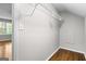 Bright walk-in closet features hardwood floors and wire shelving for ample storage space at 2487 Highland Se Dr, Conyers, GA 30013