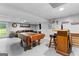 Finished basement includes a pool table and bar, perfect for entertaining guests at 435 Hampton Grn, Peachtree City, GA 30269