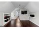 Bright bedroom boasts built-in shelves, hardwood floors, and an open doorway at 435 Hampton Grn, Peachtree City, GA 30269