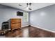 Bedroom with hardwood floors, a ceiling fan, and large window provides lots of light at 435 Hampton Grn, Peachtree City, GA 30269