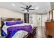 Comfortable bedroom with ceiling fan, television, and private bathroom with step-in shower at 435 Hampton Grn, Peachtree City, GA 30269