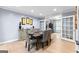 Dining room featuring a wooden table, six chairs, and a view of an adjacent office at 435 Hampton Grn, Peachtree City, GA 30269