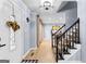 Inviting foyer with hardwood floors, a staircase, and an open view into the dining room at 435 Hampton Grn, Peachtree City, GA 30269