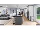 Spacious kitchen with a large island, cooktop, bar seating, and modern stainless steel appliances at 435 Hampton Grn, Peachtree City, GA 30269