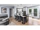 Stylish kitchen with an island offering bar seating, stainless steel appliances, and access to the outdoor space at 435 Hampton Grn, Peachtree City, GA 30269