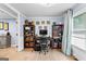 Office space featuring hardwood floors, ample storage with bookshelves, and natural light at 435 Hampton Grn, Peachtree City, GA 30269