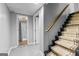 Basement staircase leading to a bathroom featuring a shower with white tiles and glass doors at 435 Hampton Grn, Peachtree City, GA 30269