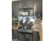 This modern kitchen has black cabinets, granite countertops, and stainless steel appliances at 620 Ne Peachtree Street # 901, Atlanta, GA 30308