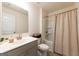 Bathroom features a single vanity with a shower-tub combination and curtain at 13568 Scenic Pkwy, Covington, GA 30014