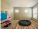 Bonus room area with comfortable pet bed and two windows at 13568 Scenic Pkwy, Covington, GA 30014