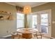 Cozy dining area with a round table, stylish chairs, and natural light at 13568 Scenic Pkwy, Covington, GA 30014