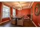 Elegant dining room features coffered ceilings, wood floors, and lots of natural light at 13568 Scenic Pkwy, Covington, GA 30014