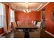Beautiful dining room with modern chandelier, and table set for six at 13568 Scenic Pkwy, Covington, GA 30014