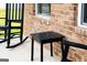 Cozy front porch with rocking chair and side table details at 13568 Scenic Pkwy, Covington, GA 30014