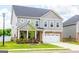Beautiful two-story home with landscaped yard and an attached two-car garage at 13568 Scenic Pkwy, Covington, GA 30014