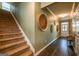 Inviting hallway with elegant staircase and decorative wall art at 13568 Scenic Pkwy, Covington, GA 30014