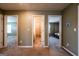 A hallway that connects several rooms including a bedroom and a bathroom at 13568 Scenic Pkwy, Covington, GA 30014