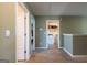 Hallway provides easy access to a bedroom and laundry room at 13568 Scenic Pkwy, Covington, GA 30014