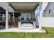 Back porch with a hot tub and steps leading up to double doors at 13568 Scenic Pkwy, Covington, GA 30014