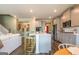 Modern kitchen showcasing an island with stools, stainless appliances and pendant lighting at 13568 Scenic Pkwy, Covington, GA 30014