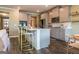 Bright kitchen featuring gray cabinets, stainless appliances, and a large island with seating at 13568 Scenic Pkwy, Covington, GA 30014