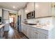 Modern kitchen with stainless steel appliances, ample counter space, and sleek cabinetry at 13568 Scenic Pkwy, Covington, GA 30014