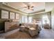 Charming main bedroom features a tray ceiling, neutral decor, and a cozy ambiance at 13568 Scenic Pkwy, Covington, GA 30014