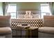 Well-appointed bedroom showcasing cozy chairs, stylish tables, and comfortable bedding at 13568 Scenic Pkwy, Covington, GA 30014
