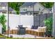 Comfortable outdoor lounge area with wicker seating, privacy screen, and decorative greenery at 13568 Scenic Pkwy, Covington, GA 30014