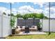 Inviting outdoor lounge area with wicker seating, string lights, and decorative privacy screen at 13568 Scenic Pkwy, Covington, GA 30014