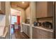 Pantry view showcases ample storage space and leads into the dining room at 13568 Scenic Pkwy, Covington, GA 30014