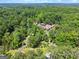 Expansive aerial view showcasing the property's lush greenery, estate, and tranquil surroundings at 1572 Azalea Dr, Lawrenceville, GA 30043