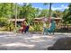 Beautiful backyard featuring colorful Adirondack chairs with a picturesque home and pavilion in the background at 1572 Azalea Dr, Lawrenceville, GA 30043