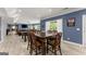 Basement area with a rec room, dining table and chairs, sofas, and a foosball table at 1572 Azalea Dr, Lawrenceville, GA 30043