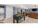 Finished basement rec room with foosball table and media space at 1572 Azalea Dr, Lawrenceville, GA 30043