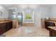 Elegant bathroom features double vanities, a soaking tub, and a glass-enclosed shower at 1572 Azalea Dr, Lawrenceville, GA 30043