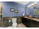 Bathroom features double sinks, a toilet, and beautiful dark stone accents at 1572 Azalea Dr, Lawrenceville, GA 30043
