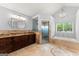 Bright bathroom with soaking tub, walk-in shower, double vanity, and decorative tile at 1572 Azalea Dr, Lawrenceville, GA 30043