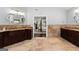 Bathroom with double vanity sinks and access to the primary bedroom at 1572 Azalea Dr, Lawrenceville, GA 30043