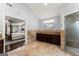 Bathroom featuring a double vanity, large mirror, and walk-in shower at 1572 Azalea Dr, Lawrenceville, GA 30043