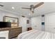 Bedroom featuring ceiling fan, hardwood floors, and dresser at 1572 Azalea Dr, Lawrenceville, GA 30043