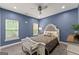Bedroom with neutral decor, carpet, and two windows at 1572 Azalea Dr, Lawrenceville, GA 30043