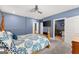 Bedroom with ceiling fan and en suite bathroom with dark stone at 1572 Azalea Dr, Lawrenceville, GA 30043