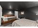 Comfortable bedroom with dark painted walls, carpet, and a door to another room at 1572 Azalea Dr, Lawrenceville, GA 30043