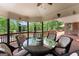 Spacious covered deck with beautiful outdoor seating, fan, and wooded views at 1572 Azalea Dr, Lawrenceville, GA 30043
