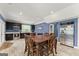 Modern kitchen featuring stainless steel appliances, dark cabinets, and a spacious dining area at 1572 Azalea Dr, Lawrenceville, GA 30043