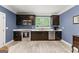 Kitchen featuring stainless steel appliances, dark wood cabinets, and a window at 1572 Azalea Dr, Lawrenceville, GA 30043