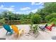 Charming lakeside retreat with colorful chairs, offering a peaceful place to unwind and enjoy nature's beauty at 1572 Azalea Dr, Lawrenceville, GA 30043