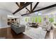 Open concept living room features hardwood floors and view of large windows at 1572 Azalea Dr, Lawrenceville, GA 30043